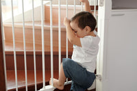 Baby in front of handrails