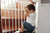 Baby in front of handrails